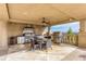 Covered outdoor kitchen and patio area, featuring stainless steel appliances and a dining area for outdoor entertaining at 2700 Paces Ferry Se Rd # 202, Atlanta, GA 30339