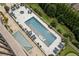 A bird's eye view of a pristine pool and hot tub area, surrounded by manicured landscapes and inviting lounge seating at 2700 Paces Ferry Se Rd # 202, Atlanta, GA 30339