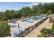 An elevated perspective capturing a sparkling pool, inviting lounge chairs, and lush greenery for a serene outdoor experience at 2700 Paces Ferry Se Rd # 202, Atlanta, GA 30339