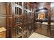A spacious, ornate wine cellar boasts wooden racks and a brick floor, perfect for connoisseurs at 2700 Paces Ferry Se Rd # 202, Atlanta, GA 30339