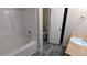 Clean bathroom featuring a bathtub, modern flooring, and vanity at 3142 Imperial Sw Cir, Atlanta, GA 30311