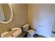 Well-maintained powder room with white fixtures, neutral tones, and a clean, classic design at 3142 Imperial Sw Cir, Atlanta, GA 30311