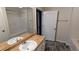 Well-lit bathroom with a large mirror, white vanity, and modern fixtures at 3142 Imperial Sw Cir, Atlanta, GA 30311