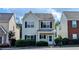 Charming two-story home featuring a welcoming front porch and neatly trimmed hedges at 3142 Imperial Sw Cir, Atlanta, GA 30311