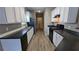 Efficient kitchen with black appliances, ample countertop space, and light-colored cabinets at 3142 Imperial Sw Cir, Atlanta, GA 30311