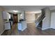Open-concept kitchen featuring sleek countertops, stainless appliances, and adjacent dining area at 3142 Imperial Sw Cir, Atlanta, GA 30311