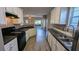 Modern kitchen showcasing countertops, an efficient layout, and views into the living area at 3142 Imperial Sw Cir, Atlanta, GA 30311