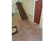 Brick entryway with a staircase and a brown door with a decorative rug at 3142 Reeves Se St, Smyrna, GA 30080