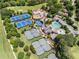 Community aerial view featuring pools, tennis courts, clubhouse, and lush landscaping at 413 Sassafras Rd, Roswell, GA 30076