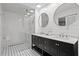 Modern bathroom with double vanity, glass shower, and stylish tile flooring at 413 Sassafras Rd, Roswell, GA 30076