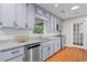 Kitchen features modern cabinetry, granite countertops, and stainless steel appliances at 413 Sassafras Rd, Roswell, GA 30076