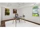 Bright office space with natural light, glass top desk, and neutral decor, perfect for working from home at 413 Sassafras Rd, Roswell, GA 30076