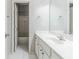 Well-lit bathroom with vanity, sink, mirror and tiled floor at 5335 Lexington View Pl, Sugar Hill, GA 30518