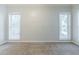Neutral bedroom features plush carpeting, large windows, and ample natural light at 5335 Lexington View Pl, Sugar Hill, GA 30518
