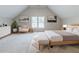Large bedroom with artwork, seating area and bed at 5335 Lexington View Pl, Sugar Hill, GA 30518