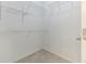Walk-in closet with metal shelving and carpeted floor at 5335 Lexington View Pl, Sugar Hill, GA 30518