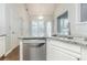 Kitchen featuring stainless steel appliances, granite counters, and ample white cabinetry at 5335 Lexington View Pl, Sugar Hill, GA 30518