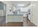 Bright kitchen featuring white cabinets, stainless steel appliances, and granite countertops at 5335 Lexington View Pl, Sugar Hill, GA 30518