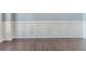 Living Room showcasing wall trim, baseboards and wood-look tile flooring at 5335 Lexington View Pl, Sugar Hill, GA 30518