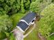 Aerial view of a meticulously maintained property with lush landscaping and mature trees at 5380 Northchester Ct, Dunwoody, GA 30338