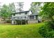 Inviting backyard with a deck overlooking the well-maintained lawn and greenery at 5380 Northchester Ct, Dunwoody, GA 30338