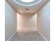 Basement hallway with tile floors, recessed ceiling, and neutral walls at 5380 Northchester Ct, Dunwoody, GA 30338