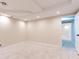 Spacious finished basement area featuring neutral walls, recessed lights, and tile flooring at 5380 Northchester Ct, Dunwoody, GA 30338