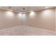 Finished basement with neutral walls, recessed lights, and tile floors at 5380 Northchester Ct, Dunwoody, GA 30338