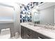 Updated bathroom featuring a double vanity, a marble countertop and modern fixtures at 5380 Northchester Ct, Dunwoody, GA 30338