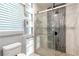 Contemporary bathroom featuring tiled walk-in shower and open shelving at 5380 Northchester Ct, Dunwoody, GA 30338