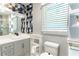 Stylish bathroom with geometric tile accent wall, modern fixtures, and vanity at 5380 Northchester Ct, Dunwoody, GA 30338