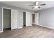 Bedroom featuring wood floors, closet, and open doorway at 5380 Northchester Ct, Dunwoody, GA 30338