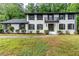 Classic home featuring a brick facade, manicured landscaping, and a welcoming front entrance at 5380 Northchester Ct, Dunwoody, GA 30338