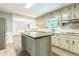 Bright eat-in kitchen with stainless steel appliances and a center island at 5380 Northchester Ct, Dunwoody, GA 30338
