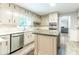 Large eat-in kitchen featuring a center island, stainless steel appliances, and white cabinets at 5380 Northchester Ct, Dunwoody, GA 30338