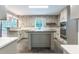 Eat-in kitchen with ample counter space, white cabinets, and stainless steel appliances at 5380 Northchester Ct, Dunwoody, GA 30338