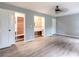 Spacious main bedroom featuring hardwood floors, a ceiling fan and walk-in closets at 5380 Northchester Ct, Dunwoody, GA 30338
