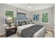 Cozy bedroom with natural light, stylish decor, and hardwood floors at 789 Third St, Stone Mountain, GA 30083
