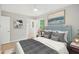 Comfortable bedroom with a view to an ensuite bathroom, tasteful decor, and ample natural light at 789 Third St, Stone Mountain, GA 30083