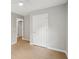 Bedroom with light walls, wood floors and white doors at 789 Third St, Stone Mountain, GA 30083