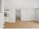 Open-concept space features clean lines, modern lighting, and light wood floors throughout at 789 Third St, Stone Mountain, GA 30083