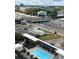 Aerial view of the condo building with a pool and highway, showcasing the urban surroundings at 1280 W Peachtree Nw St # 2409, Atlanta, GA 30309