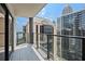 City view from private balcony with tile flooring and modern glass railings providing a stylish outdoor space at 1280 W Peachtree Nw St # 2409, Atlanta, GA 30309