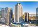 High-rise condo building with pool, tennis court, and stunning city views on a clear, sunny day at 1280 W Peachtree Nw St # 2409, Atlanta, GA 30309