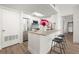 Bright kitchen featuring stainless steel appliances, a breakfast bar, and sleek cabinetry at 1280 W Peachtree Nw St # 2409, Atlanta, GA 30309