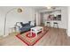 Inviting living area with hardwood floors, and stylish furniture, seamlessly connected to the kitchen and breakfast bar at 1280 W Peachtree Nw St # 2409, Atlanta, GA 30309