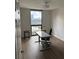 Bright office space with large window, hardwood floors, and modern desk setup at 1280 W Peachtree Nw St # 2409, Atlanta, GA 30309