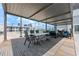 Outdoor patio with comfortable seating, dining area, and covered pergola for entertaining at 1280 W Peachtree Nw St # 2409, Atlanta, GA 30309