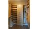 Walk-in closet with custom shelves and storage options for organized living at 1280 W Peachtree Nw St # 2409, Atlanta, GA 30309