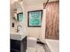Bathroom features a modern vanity, luxury fixtures, and a marble floor at 1722 San Gabriel Ave, Decatur, GA 30032